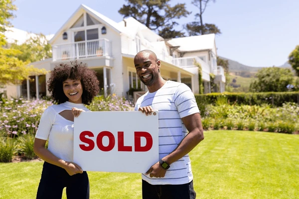 First-time home buyer family in front of a house in Modesto California